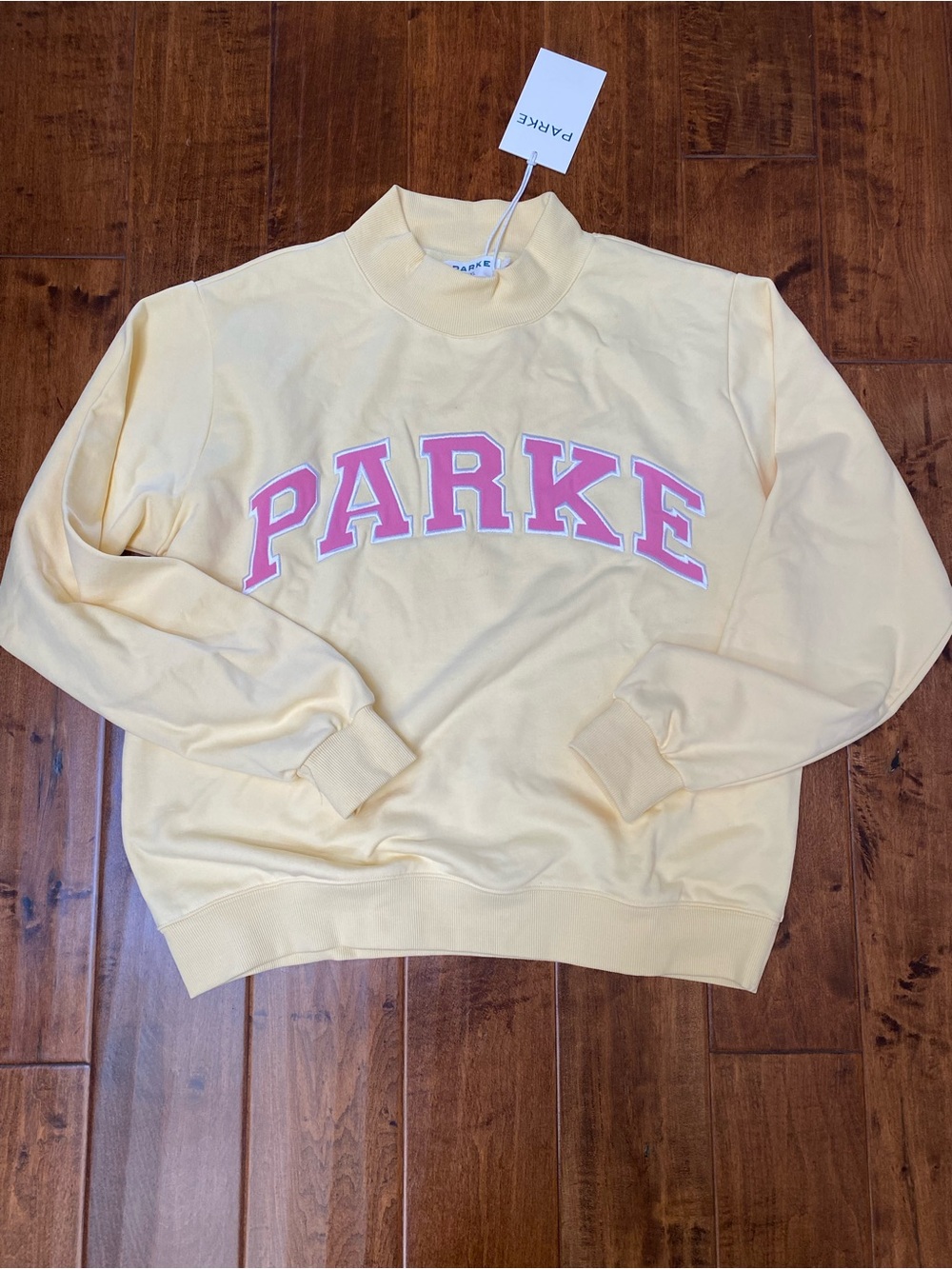 Parke Pastel Yellow mockneck Sweatshirt with Pink Logo